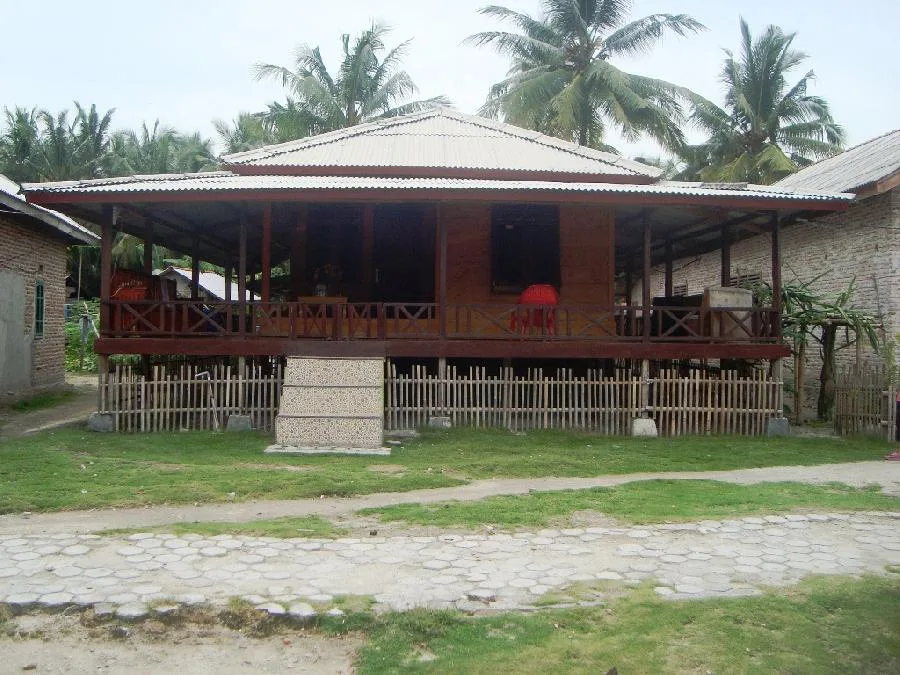A local wooden guesthouse with a wide veranda on Pulau Pahawang